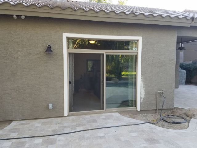 This was a window to patio door conversion. Stared as a bedroom window and the homeowner wanted to add a patio door instead. We preformed the cut down of the new opening and supplied a beautiful Simonton Contemporary Patio Door with a window / transom abo